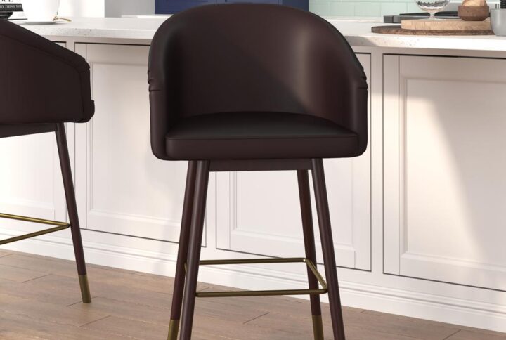 Bring your home or business into the 21st century with the modern trendy style of this commercial grade stool available in bar and counter heights. Covered in soft and durable LeatherSoft upholstery and boasting soft bronze accents on the legs and footrest