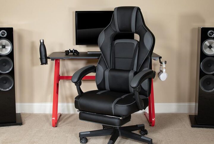 You're going to enjoy playing on this high-performance racing gaming chair with massaging lumbar and slide-out footrest. This modern gaming chair is paired with an equally modern red-z-framed gaming desk to get in all your essential playtime. with an adjustable and removable headrest pillow and massaging lumbar pillow. For maximum support this office chair with footrest engages by pulling the loop then flipping the footrest up to elevate your feet and has a separate lever to recline the back 87° ~ 145°. Plug in the 3 foot USB cord to get a relaxing massage from the lumbar pillow. The black top gamers table can hold up to two monitors and has two grommets for cable management. Always know where your headset is with the included headrest hook while you keep your desktop and pc gaming keyboard clear of accidental spills by placing hot and cold beverages in the cup holder. Your online followers will know that you're serious when they see you in your reclining gaming chair with footrest.