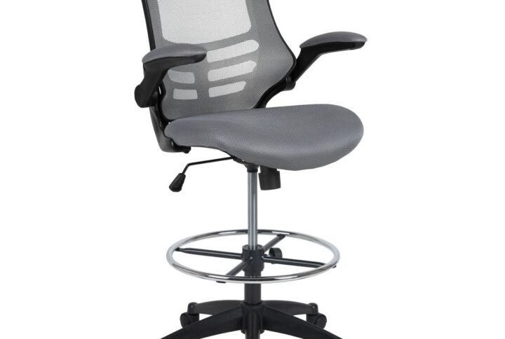 Whether you work from home or go into the office you will be comfortable with the Mid-Back Dark Gray Mesh Ergonomic Drafting Chair with Adjustable Foot Ring and Flip-Up Arms. This tall task chair is the perfect height for sit-to-stand desks