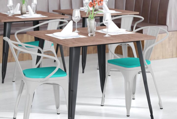 Spice up your kitchen or dining room by adding this colorful black metal chair with a long-lasting poly resin seat to your space. Whether your space is shabby chic