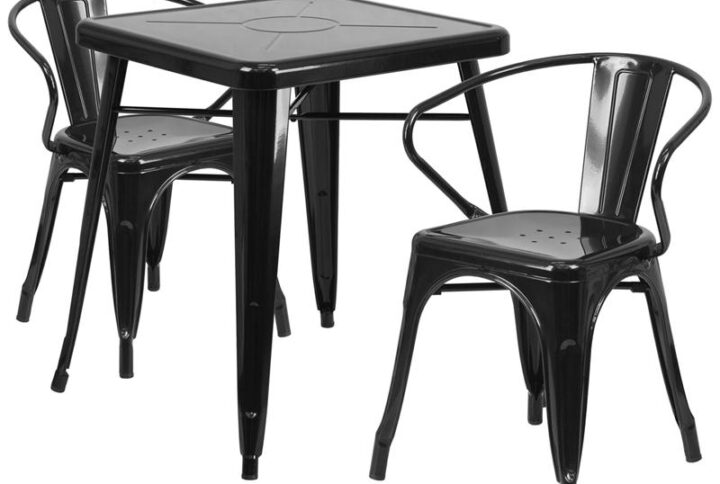 The trendy square indoor-outdoor metal dining table with two arm chairs will give your dining room or bar decor a cool retro-vintage feel. The table top measures 23.75 inches square and has a 2 inch lip with rounded corners. Cross braces add increased stability while still allowing ample leg room. The stackable cafe style chairs feature curved backs with a vertical slat
