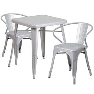 The trendy square indoor-outdoor metal dining table with two arm chairs will give your dining room or bar decor a cool retro-vintage feel. The table top measures 23.75 inches square and has a 2 inch lip with rounded corners. Cross braces add increased stability while still allowing ample leg room. The stackable cafe style chairs feature curved backs with a vertical slat