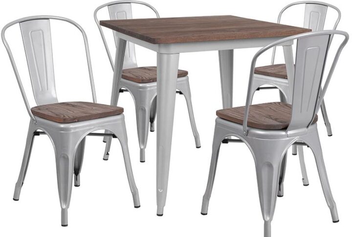 The trendy metal dining table with stack chairs will give your dining room or bar decor a refreshing rustic feel with its wood features. The table has a shiny metal frame that is topped off with an appealing textured wood top. The stackable bistro style chairs feature curved backs with a vertical slat and a cross brace under the seat for added support and stability. Plastic bumpers on the cross brace protect the chairs' finish from scratches when stacking them and rubber floor glides protect your floor by sliding smoothly when you need to move them. Designed for both commercial and residential use