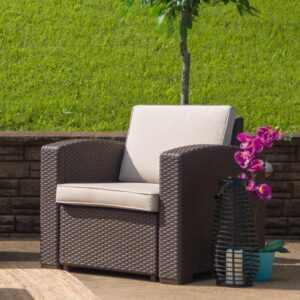 Create an amazing outdoor space with this comfortable and stylish chocolate brown patio chair. The durable resin frame offers a stylish appearance which replicates rattan. Deep seating enhances the comfort level. Beige all-weather cushions will hold up all season long. Clean up spills with a water-based cleaner or the cushions are zipper removable for washing purposes when spot cleaning just isn't enough. Curl up with your latest read