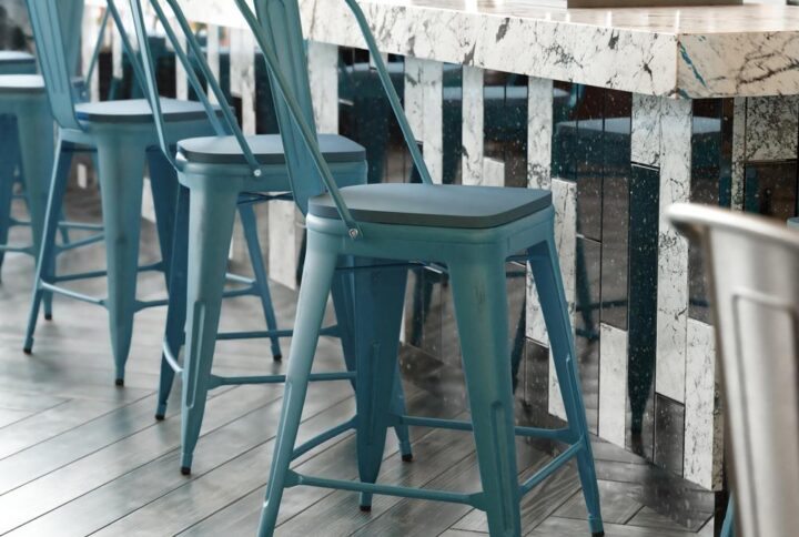 Refresh the seating in your indoor or outdoor entertaining spaces with this colorful metal counter stool with an all-weather poly resin seat. Whether setting up a cozy space in your kitchen to enjoy a light breakfast or appointing your restaurant or bistro