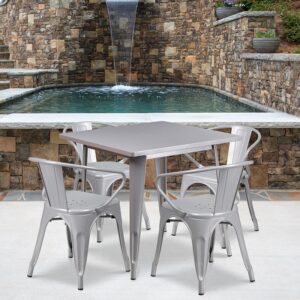 The indoor-outdoor square metal cafe table with four arm chairs  will give your dining room or bar decor a cool retro-vintage look. The table top measures 31.5 inches square and has a smooth top with a 1 inch edge. A stabilizing brace underneath the top gives this table increased stability while still allowing ample leg room. The arm chairs feature curved backs with a vertical slat