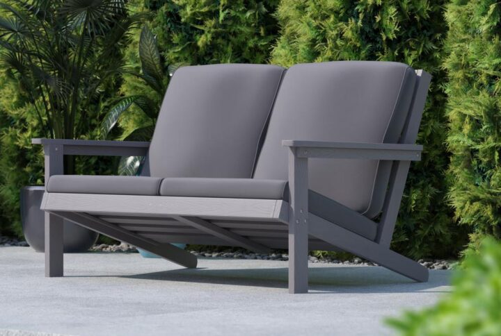 Give a fresh new take to any indoor or outdoor space with this modern Adirondack style deep seat loveseat with cushions. The streamlined back and arms give this 2 seat chair a sleek profile that will complement any décor while the foam filled cushions keep you comfy and cozy. Constructed of weather-resistant polystyrene