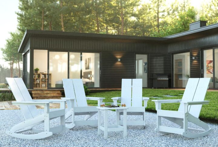 Take comfort anywhere you are with this set of 4 modern dual slat Adirondack rocking chairs with side table. This 5 piece seating set boasts an update on the classic Adirondack chair and is ideal on the front porch and in your sunroom. The smooth motion rockers allow you to rest and relax while the side table holds your belongings or decor. Designed to stand up to almost any environment
