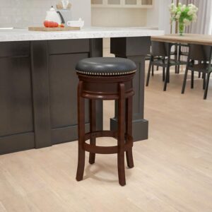 Set a welcoming tone at your kitchen island or bar with this swivel bar height stool featuring soft and durable black LeatherSoft upholstery. These traditional stools will look gorgeous around your pool table to give everyone a good view while playing or waiting to take on the winner. This swivel stool is crafted from a durable wooden frame with a cappuccino finish and has floor glides that'll protect your hard surfaced flooring. Clean up spills with a solvent and water-based cleaner such as foam to keep this stool looking great. Backless stools allow full access seating from every angle and provide a clean line of vision when pushed underneath kitchen island overhangs. The circular footrest stabilizes the stool and supports your feet for comfort. Attractively styled with nailhead trimming and bowed legs