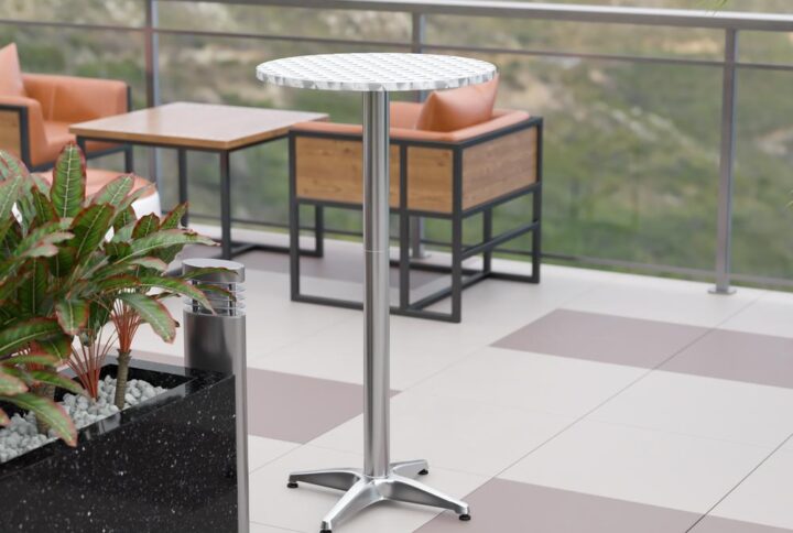 Give guests a place to chat or some much needed real estate to hold glasses or hors d'oeuver plates with this aluminum bar height table. The shiny aluminum finish paired with a smooth designer looking top makes a great addition to any event venue