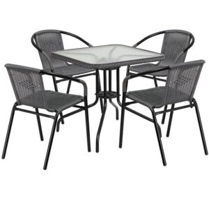 this square table and 4 chair set is just what you need. The table's rippled designer glass top has a smooth surface for keeping items level. The rattan edge band complements the chairs and adds just the right touch for a stylish cohesive look. The lightweight chairs feature a curved back