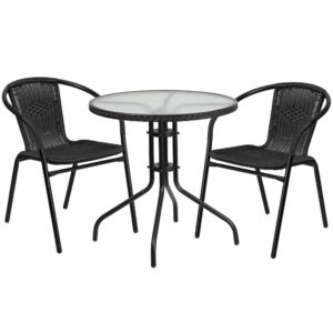 this round table and 2 chair set is just what you need. The table's rippled designer glass top has a smooth surface for keeping items level. The rattan edge band complements the chairs and adds just the right touch for a stylish cohesive look. The lightweight chairs feature a curved back