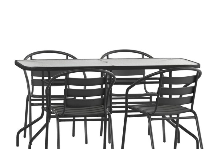 Have the beautiful patio or deck setting you've always wanted at your home or business with this modern black outdoor patio dining set for 4. The sizable rectangular outdoor glass table has a designer rippled look