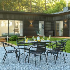 but is smooth to the touch to keep items level. The black metal base and frame provide a striking contrast to the glass top for an on-trend look. The overall design is enhanced by the aluminum slat back chairs