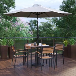 shady spot for dining or relaxing at your home or business is in this 7 piece patio set. Patrons love to dine al fresco and this all-weather dining set won't disappoint. The trending natural colored synthetic faux teak slats contrast beautifully with the black metal frames and blend seamlessly in almost any decor. The included gray polyester umbrella with base will protect your electronics and pets from overheating. Entertain guests at your home or restaurant with this on-trend outdoor seating bundle. The 18 gauge steel frame of the patio table features metal screw construction that holds up to 300 Lbs. static weight capacity to effortlessly hold your favorite dishes while the 12 gauge aluminum patio chairs stack up to 27 high for storage or cleaning. The 30+ UV treated polyester umbrella boasts push button tilt to keep you shaded no matter where the sun is. Powder coating on the dining table