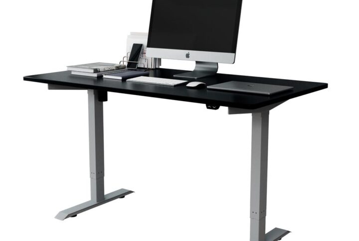 Elevate your workspace with our newest electric stand-up desk. This sleek designed desk is crafted from a durable particleboard desktop and a heavy-duty steel reinforced frame with T-Style legs.  It embodies a contemporary ergonomic design with high-quality construction. The height control panel includes four digital memory presets as well as individual up & down buttons. The height adjustment allows your desk surface to rise from 29 inches up to 49 inches in a matter of seconds - perfect for all. Swiftly and smoothly transition between a variety of ergonomic work positions with a touch of a button. Many studies have shown that these electric-sit-to-stand desks enhance productivity and focus with comfort.