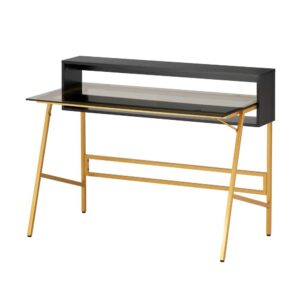 coupled with an open dual storage shelf system. The Laminated wood finish adds to its modern contemporary feel while also having a wide and sturdy frame. This desk is essential for small work places with its small foot print. The desk area is made of a smoke tempered-glass table top that is supported by gold color metal legs.