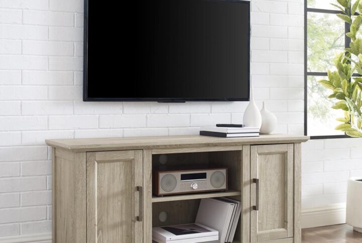 Gather together for a family movie night with the Camden 48” Low Profile TV Stand. This TV stand features two cabinets with an adjustable shelf in each