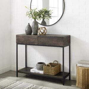 Bring a modern edge to your entryway or living room with the Jacobsen Console Table. The streamlined industrial look of the console table combines sturdy steel with the look of rich wood. But
