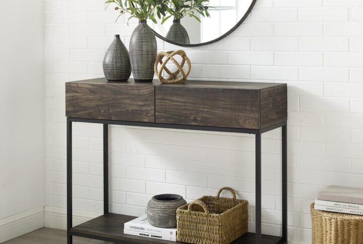 Bring a modern edge to your entryway or living room with the Jacobsen Console Table. The streamlined industrial look of the console table combines sturdy steel with the look of rich wood. But