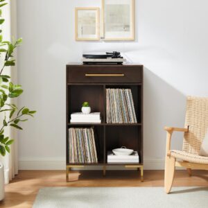 this bookcase has four cube shelves sized perfectly for standard records as well as books or decor. The drawer offers storage for electronic accessories and cleaning supplies