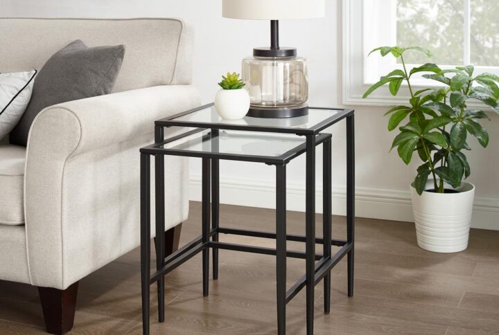 Bring extra table space to any room with the Ashton 2pc Nesting Table Set. Tempered glass tabletops offer space for a lamp