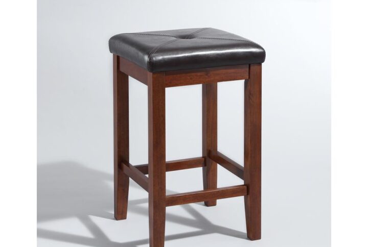 Simplicity and comfort are hallmarks of the Square Seat 2pc Counter Stool Set. The square seat is upholstered in a durable yet stylish faux leather