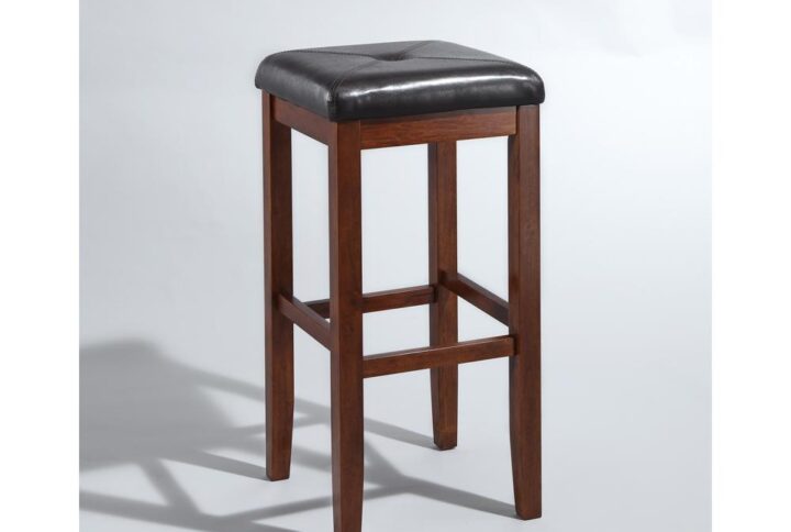 Simplicity and comfort are hallmarks of the Square Seat 2pc Bar Stool Set. The square seat is upholstered in a durable yet stylish faux leather