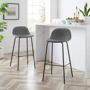 creating versatile seating for a kitchen or dining area. Featuring upholstered bucket style seats on tapered steel legs
