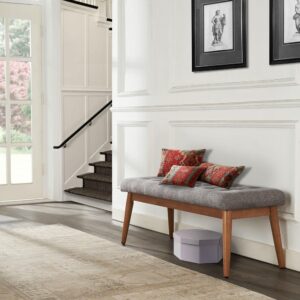 this bench is ready to add a dash of style to your home. The button-tufted upholstery is comfortable