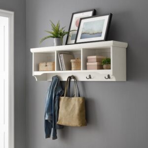 You’ll be ready to hang your hat when you come home to the Seaside Storage Shelf in your entryway. This wall mounted storage shelf makes a great companion to an entryway bench or console table. The beautiful distressed finish and beadboard accents bring an upscale coastal vibe to the three storage cubbies and four double prong hooks. Make your home fashionable and functional with the Seaside Storage Shelf.