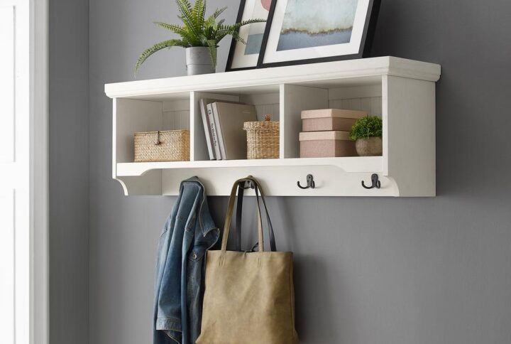 You’ll be ready to hang your hat when you come home to the Seaside Storage Shelf in your entryway. This wall mounted storage shelf makes a great companion to an entryway bench or console table. The beautiful distressed finish and beadboard accents bring an upscale coastal vibe to the three storage cubbies and four double prong hooks. Make your home fashionable and functional with the Seaside Storage Shelf.