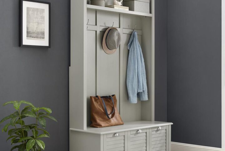 Keep your home’s entryway tidy and organized with the classic Ellison Hall Tree. Featuring louvered accents on the bottom drawer and raised paneling on the back
