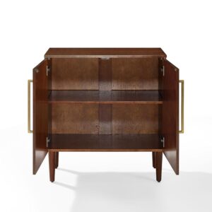 this cabinet features round tapered legs and classic bar hardware.  Tucked behind the doors is one adjustable shelf