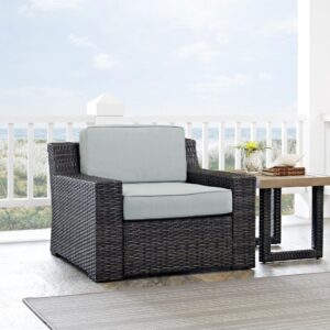 the Beaufort armchair’s sophisticated silhouette is the perfect perch for relaxing outdoors.