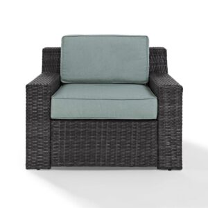 Create an instant oasis with the generous seating of the Beaufort Armchair. This outdoor chair has a beautifully woven flat resin wicker over a powder-coated steel frame and thick moisture-resistant cushions. With a low-profile and understated curves