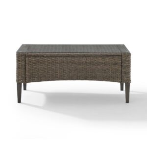 the Rockport Coffee Table adds just the right amount of table space for resting a cool drink on a hot day. The all-weather resin wicker is beautifully woven over a powder-coated steel frame
