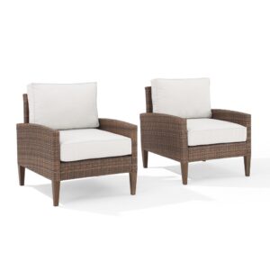 this patio set is a chic upgrade to your outdoor space. All-weather resin wicker and quick-drying olefin fabric come together to create durable outdoor chairs. The classic tapered legs are made from sturdy steel hand-painted to look like real wood