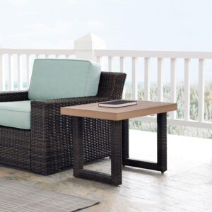 this patio table's slatted top is the perfect spot to rest a snack or beverage. With contemporary squared legs wrapped in all-weather resin wicker