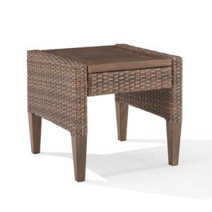 this side table is a durable outdoor essential. The Capella side table blends cool neutral tones and a natural finish to add a coastal vibe to your outdoor space.