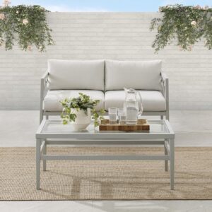 both the loveseat and coffee table are as durable as they are stylish. Interlocking circle accents adorn the loveseat