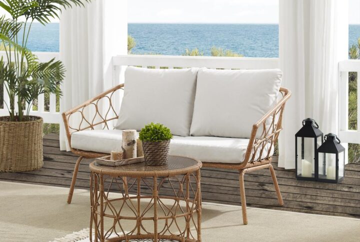 Turn your patio into a breezy bohemian retreat with the Juniper 2pc Conversation Set. Crafted from rattan-style resin wicker