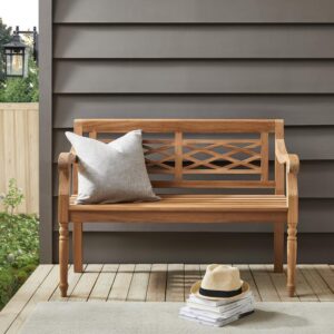 the Olivier Teak Bench is ideal for a small patio or porch. Featuring detailed carving and turned legs
