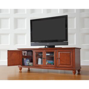 while pre-cut cable management holes to keep power cords corralled and hidden. Classic details like raised panel doors and turned feet make the Cambridge 60” Low Profile TV Stand a compact and stylish addition to your home.
