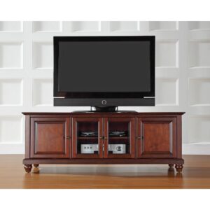 while pre-cut cable management holes to keep power cords corralled and hidden. Classic details like raised panel doors and turned feet make the Cambridge 60” Low Profile TV Stand a compact and stylish addition to your home.