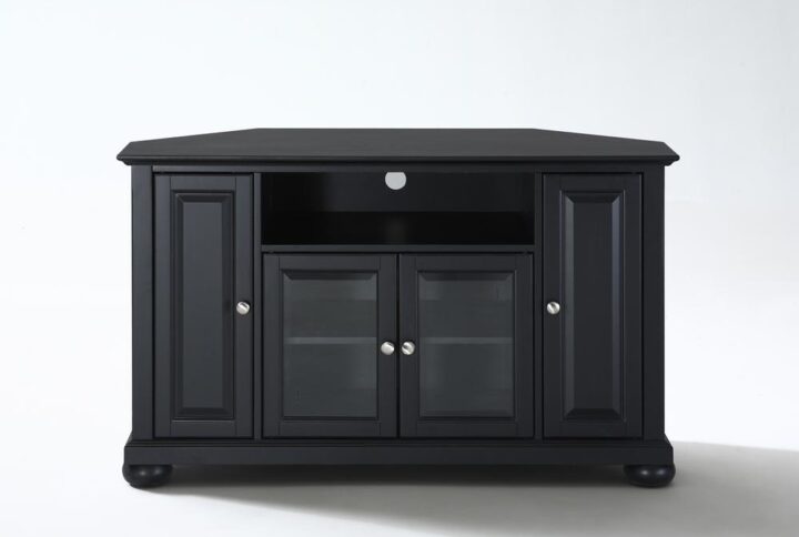 The Alexandria 48” Corner TV Cabinet accommodates most flat-panel TVs up to 50-inches and tucks neatly into any corner of your home. Two cabinets have raised panel doors for concealed storage. The center cabinet has beveled glass doors that protect valued electronic components while allowing for complete use of remote controls. The open storage area generously houses a variety of media players