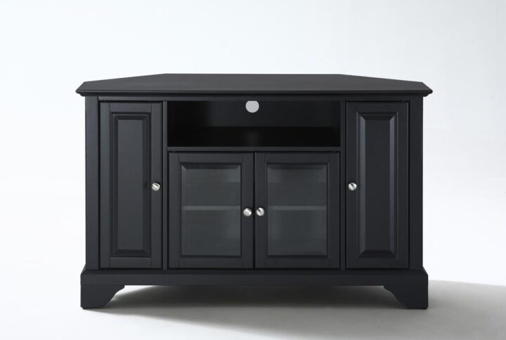 The Lafayette 48” Corner TV Cabinet accommodates most flat-panel TVs up to 50-inches and tucks neatly into any corner of your home. Two cabinets have raised panel doors for concealed storage. The center cabinet has beveled glass doors that protect valued electronic components while allowing for complete use of remote controls. The open storage area generously houses a variety of media players