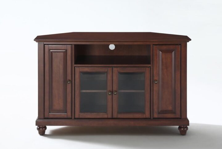 The Cambridge 48” Corner TV Cabinet accommodates most flat-panel TVs up to 50-inches and tucks neatly into any corner of your home. Two cabinets have raised panel doors for concealed storage. The center cabinet has beveled glass doors that protect valued electronic components while allowing for complete use of remote controls. The open storage area generously houses a variety of media players