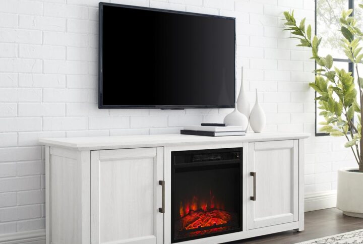 Cozy up for a relaxing evening with the Camden 58” Low Profile TV Stand with fireplace. This tv console looks great showcasing your television while keeping media necessities hidden away. Each cabinet features an adjustable shelf that adapts to your storage needs. With an electric fireplace in the center compartment