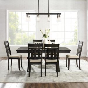 the Hayden 7pc Dining Set brings rustic style to family gatherings. This set features a table with an 18” extension leaf that accommodates the six included dining chairs and without the leaf accommodates four. The X-shaped legs of the table complement the classic slat back design of the dining chair